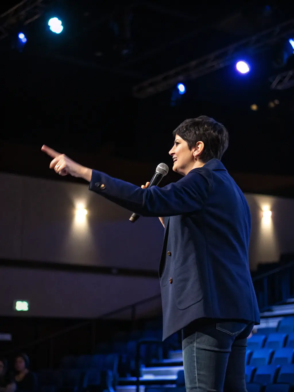A professional headshot of a keynote speaker at the Startup Conferences International, smiling confidently and engaging with the audience during their presentation on investment strategies.